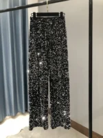 Sequin pants with a dazzling black and silver sparkle, perfect for stylish occasions.
