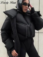 Bold black puffer jacket with hood and stylish sunglasses, perfect for winter fashion.