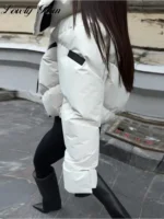 White oversized puffer jacket with black accents, stylish winter outerwear for women.
