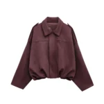 Soft burgundy oversized jacket with shoulder epaulets and cozy interior.